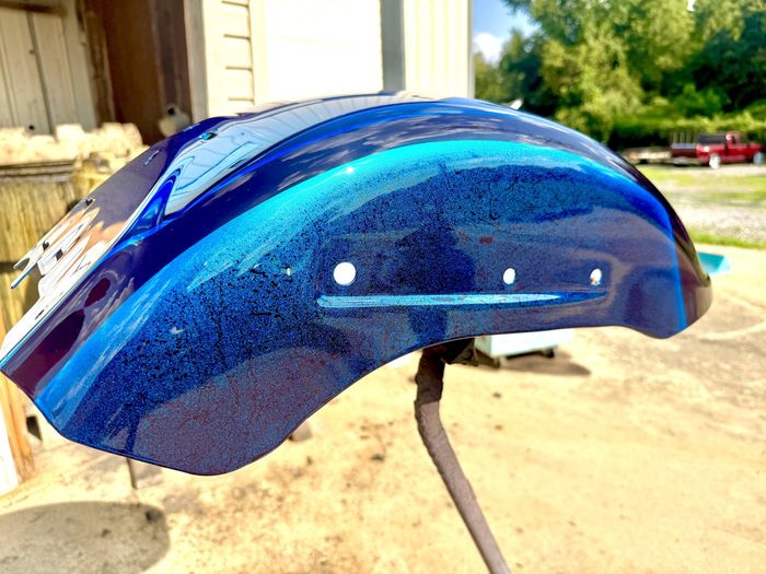 Mirror blue PVD fender outdoors