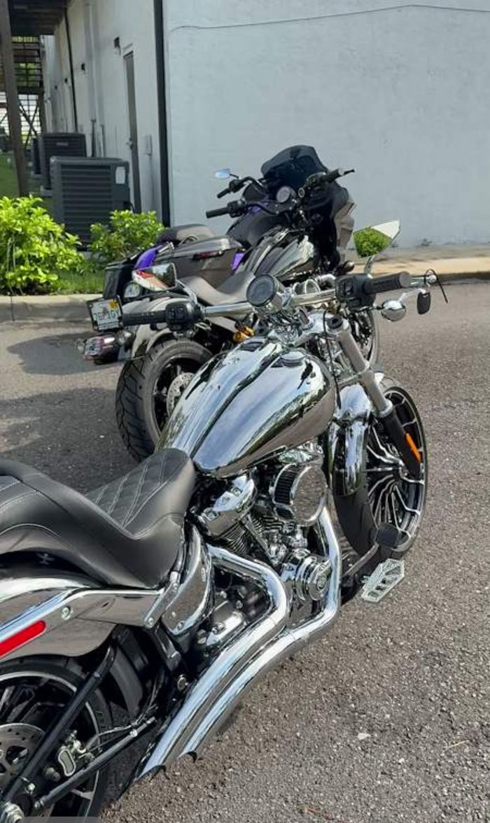 Chrome finished cruiser lined up with other custom bikes