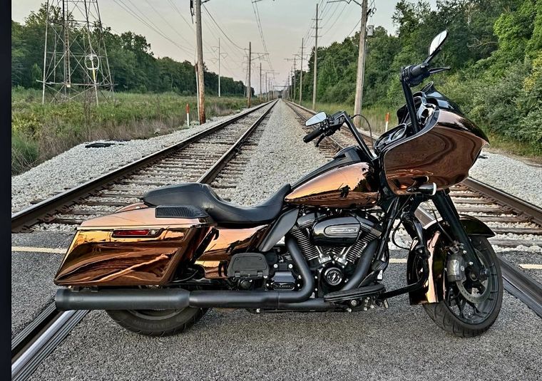 Full copper PVD bagger parked on railroad tracks